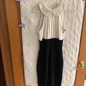 Elegant Black and White Dress with Pearl Collar